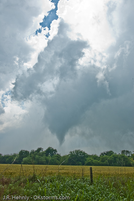 Clear sky seen behind the updraft and tornado.