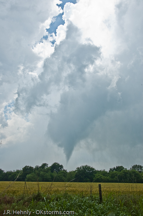 Clear sky seen behind the updraft and tornado.