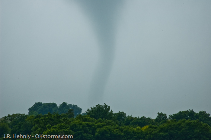 Tornado west of Bison, OK ramains on the ground for several minutes.