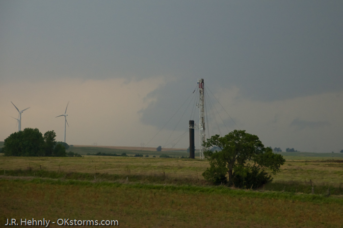 Looking west at numerous lowerings and scud clouds