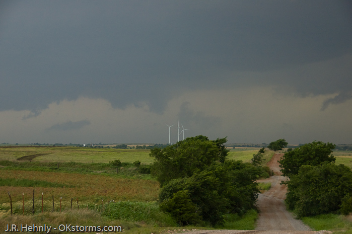 Looking west at numerous lowerings and scud clouds