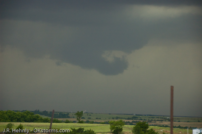 Looking west at numerous lowerings and scud clouds