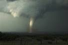 The southern storm produces a very nice tornado as it crosses over the Caprock Canyon State Park. One of the best scenes was when the side was illuminated by the sun the tornado crossed the Red River and threw up a spray of red water.