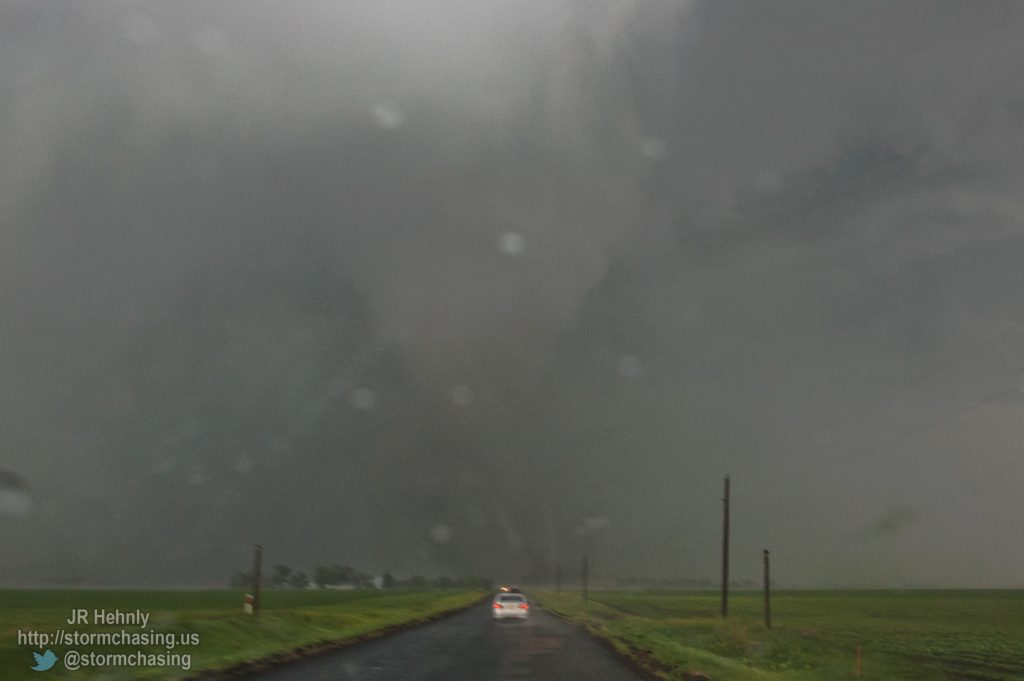 Multiple vorticies dance across the road as the tornado crosses in front of us. - 6/20/2011 5:55:35 PM - 4 miles north of Bradshaw, NE - Bradshaw, NE - 