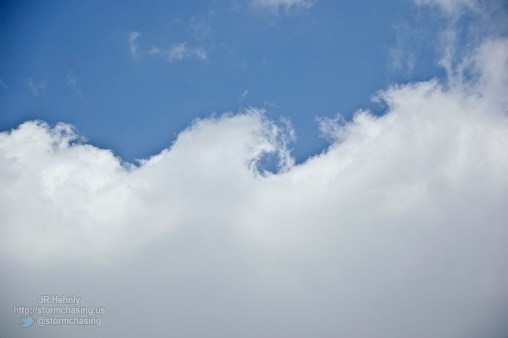 Tops of the cumulus clouds curling, - 5/27/2012 2:04:28 PM - Phillipsburg, Kansas - USA - 