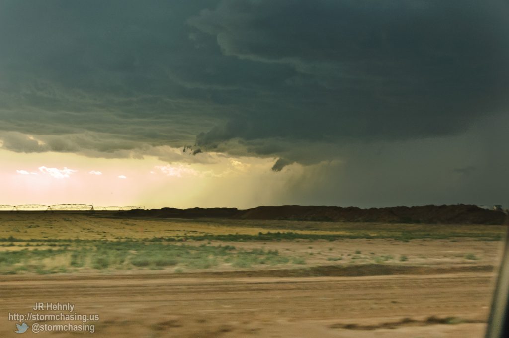 Ragged lowerings on the stom to my southwest as I pass a cattle feedlot - 6/1/2012 5:47:36 PM - Hartley, Texas - USA - 