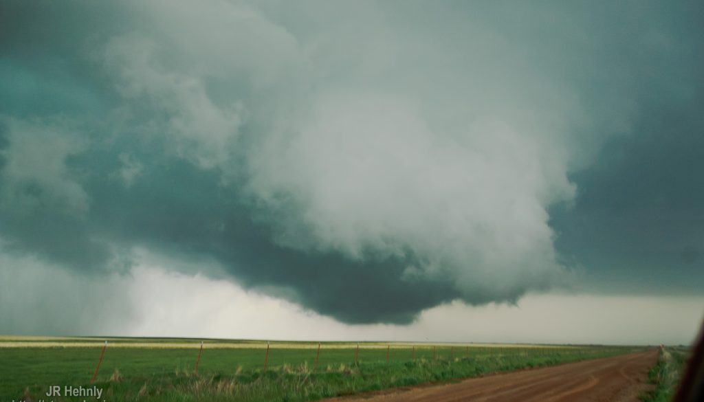 Storm is tornado warned as it wrapps up and produces intermittent vorticies beneath a rapidly rotating wall cloud - 4/17/2013 4:35:06 PM - Frederick, Oklahoma - USA - 