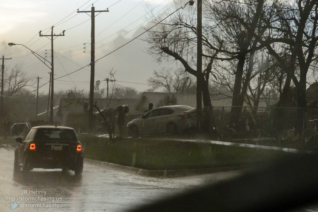 I would like to know what led to this car smashing into the telephone pole here. It's a long way from any road. The house to the right of it is missing its roof. - 3/25/2015 7:34:44 PM - Southwest 4th Street - Moore, Oklahoma - 
