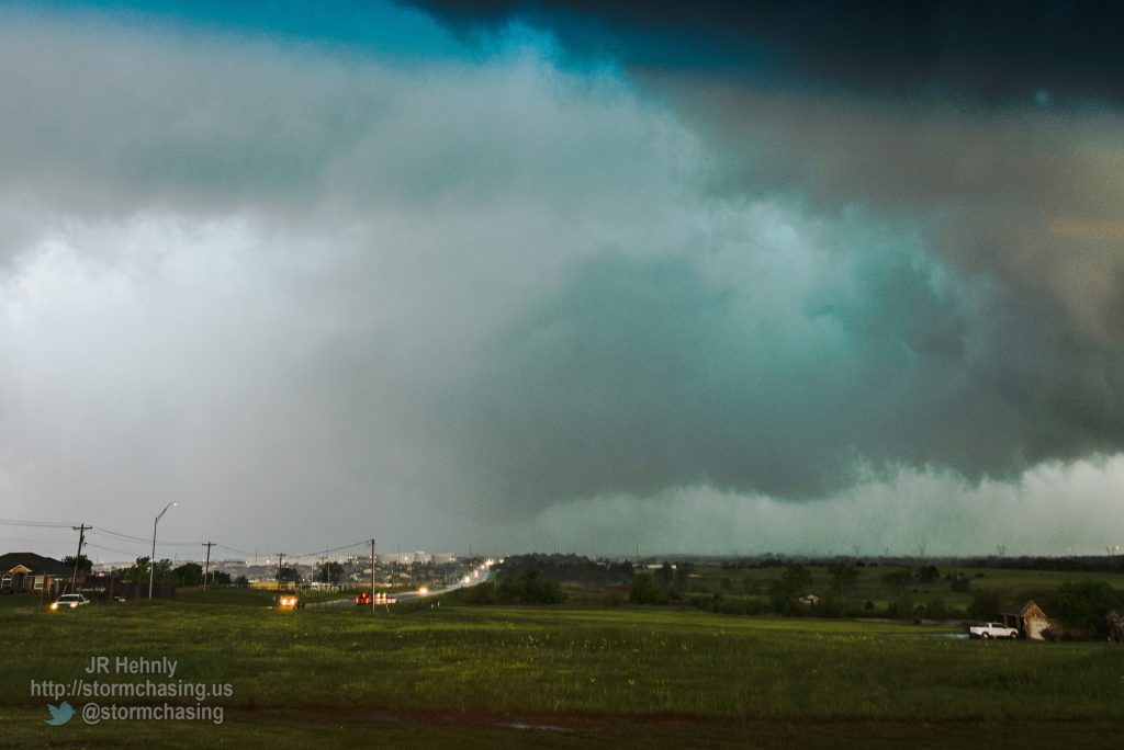 East of the hospital looking west down Tecumseh road, and the funnel is barely visible through the rain, but power flashes confirm it’s a tornado in contact with the ground. - 5/6/2015 5:56:46 PM - West Tecumseh Road - Norman, Oklahoma - 