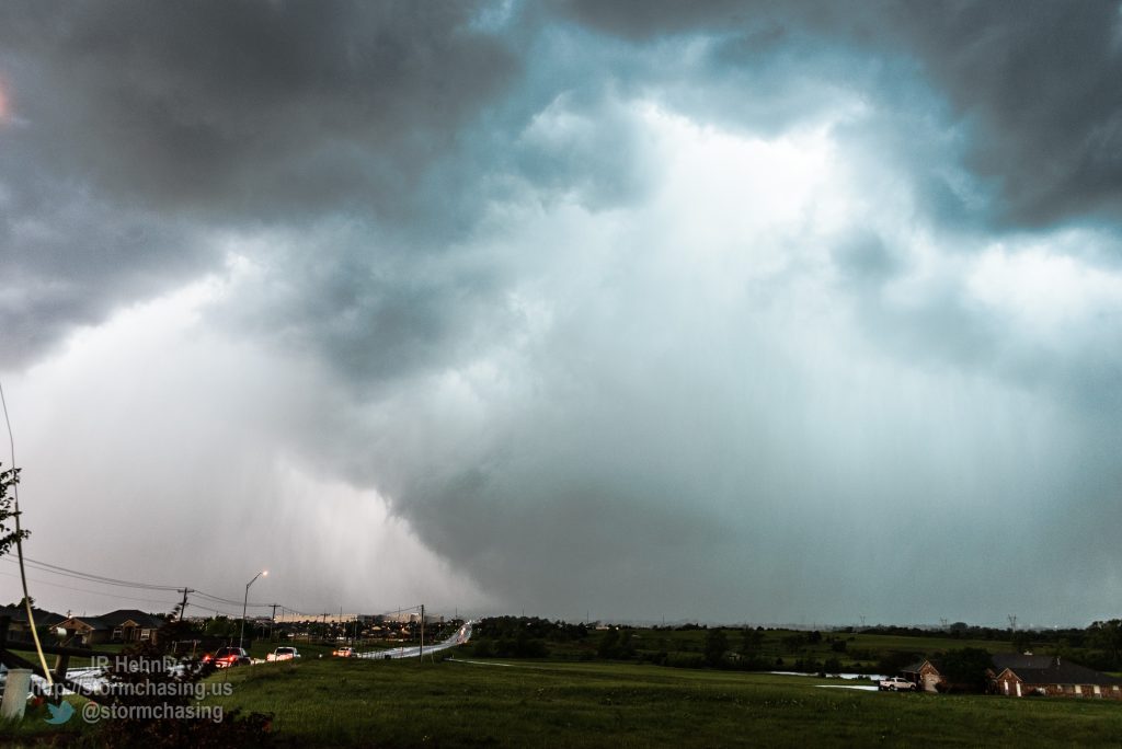 East of the hospital looking west down Tecumseh road, and the funnel is barely visible through the rain, but power flashes confirm it’s a tornado in contact with the ground. - 5/6/2015 6:03:48 PM - West Tecumseh Road - Norman, Oklahoma - 